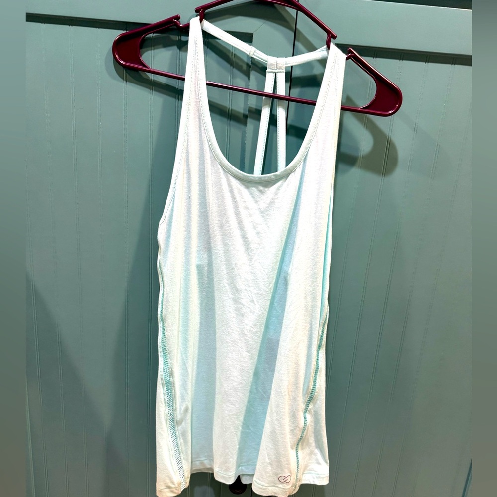 Calia brand, size medium, mesh trim, racer back tank ,icy blue color